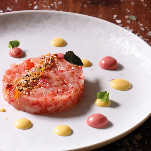 Red prawn tartare with delicate dots of sauce